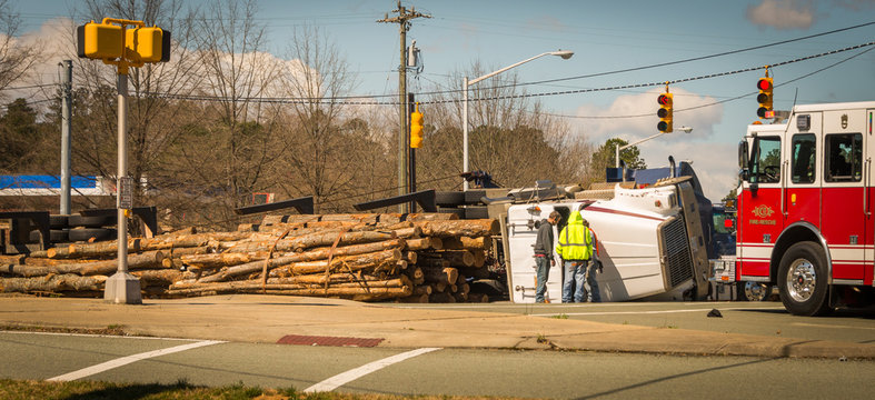 Fire truck and overturned logging truck