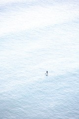 Man on paddle board in ocean