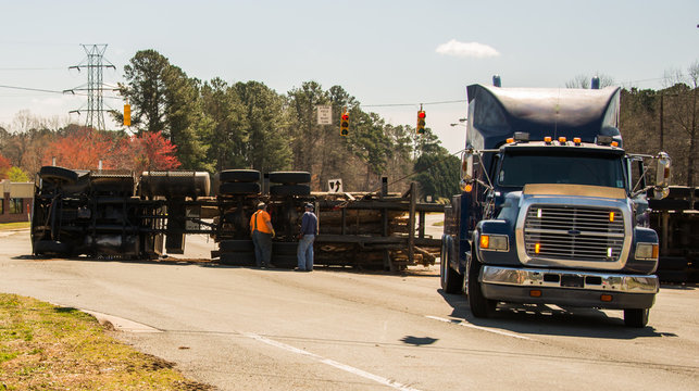 Logging Truck Turned Over On Highway