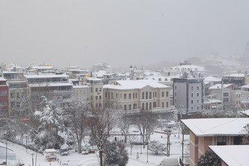 Obraz premium A winter view from the city of Istanbul with houses covered with white snow