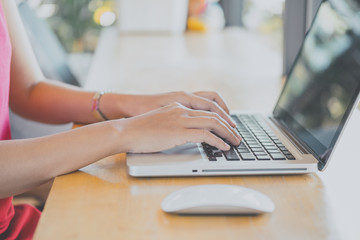 Hipster woman working with laptop