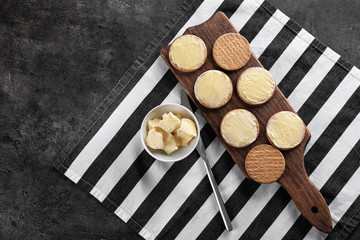 Composition with fresh butter and cookies on table, top view
