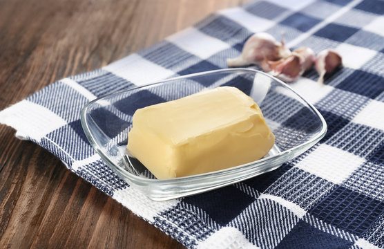 Glass dish with healthy butter on table
