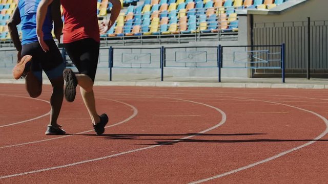 Football players running fast, training before important match, active life