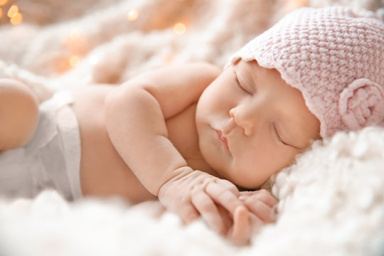 Cute Newborn Baby Girl Lying On Plaid