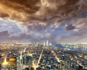 Fototapeta premium New York City by night. Aerial view of Manhattan lights, USA