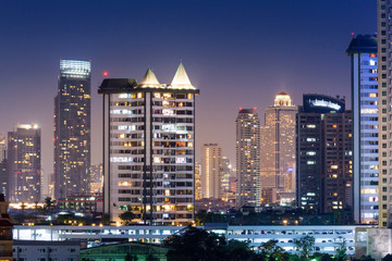 Fototapeta na wymiar Night architecture Business office building and Modern complex of apartment buildings Bangkok , Thailand