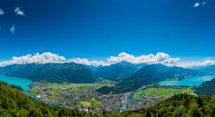 The beautiful panorama of Interlaken valley and Thunersee river through the city - obrazy, fototapety, plakaty