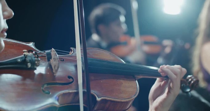 string quartet performs on stage, detail shot