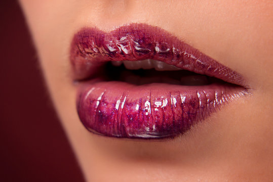 Luscious lips with dark red lipstick closeup