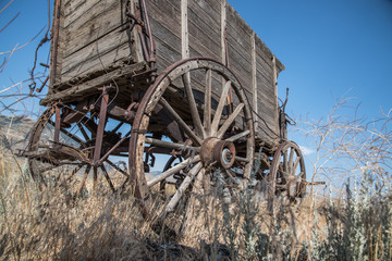 Fototapeta na wymiar Antique Western Carriage with Wagon Wheel