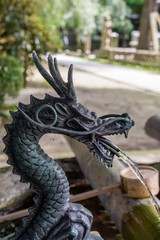 japanese shrine purification fountain in dragon shape