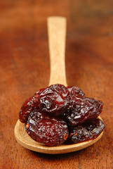  Red berries on  a wood spoon 