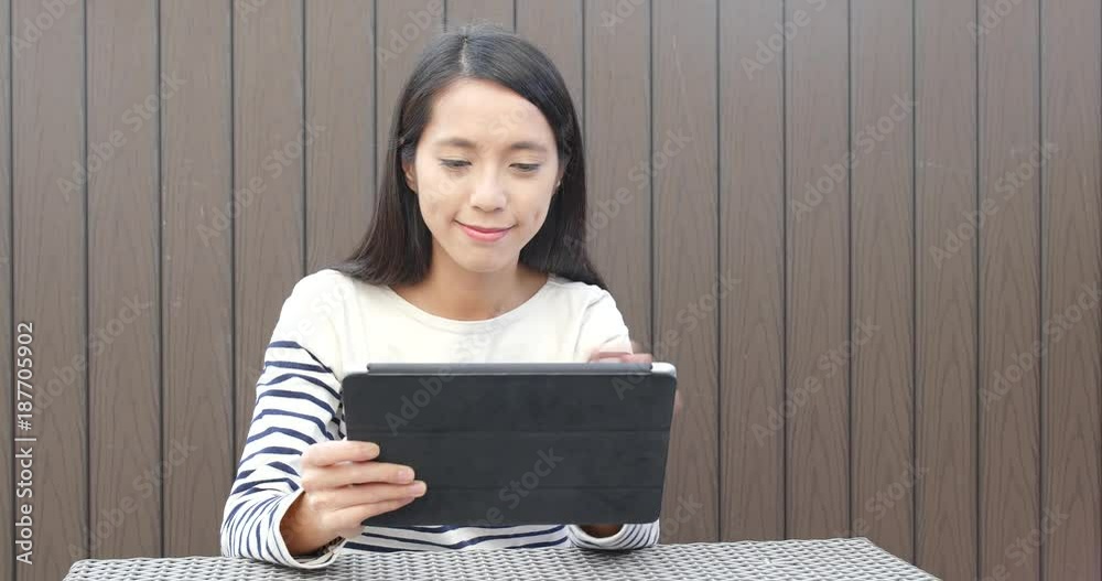 Poster Woman use of tablet computer for online