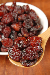  Red berries on  a wood spoon 