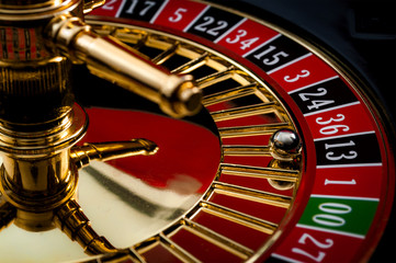 Lucky thirteen and casino gambling concept with a closeup on a section of the of roulette wheel...