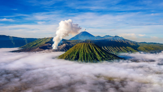 Mountains Bromo volcano (Gunung Bromo) during sunrise from viewpoint on Mount Penanjakan in Bromo Tengger Semeru National Park, East Java, Indonesia.