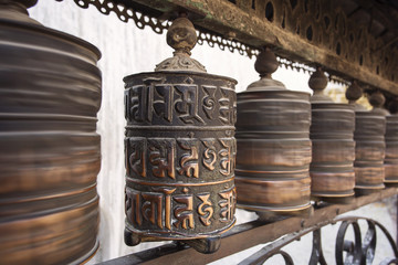 Prayer wheels made from metal at Swayambhunath Temple - Monkey Temple, Kathmandu, Nepal