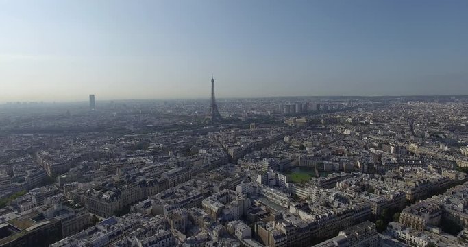 PARIS, FRANCE  – SEPTEMBER 2016 : Aerial shot over central Paris cityscape with view of Eiffel Tower and skyline on a sunny day