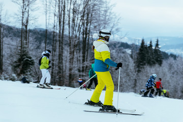 people skiing and snowboarding at winter  mountains