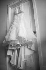 Wedding dress hanging on a door