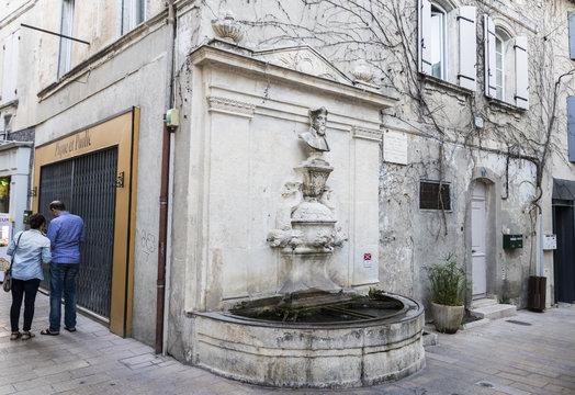 Water fountain with a bust of Michel de Nostradame or Nostradamus in the Old Town of his hometown and birthplace of Saint-Remy-de-Provence, France