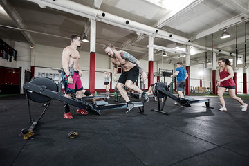 Obraz na płótnie Canvas Clients Exercising In Fitness Club