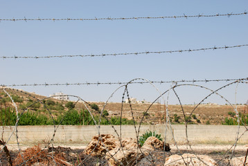Barbed wire fence at israeli palestinian border