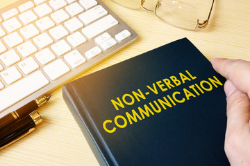 Book about NVC Non-verbal communication on a table.