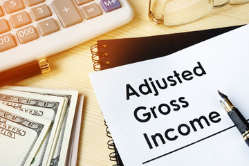 Document with title Adjusted gross income AGI. - obrazy, fototapety, plakaty