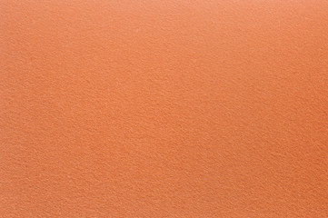Felt surface in orange color. Abstract background and texture for design.