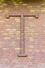 Bricks wall with letter t
