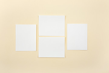 Obraz na płótnie Canvas Blank white paper cards on a soft color background, business cards mockup