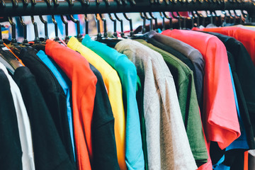 Closeup of T-shirts in the shopping mall, fashion and shopping concept.