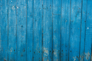 Fototapeta na wymiar Old blue planking fence