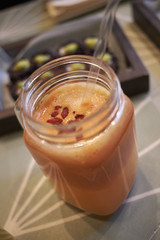 Milan, Italy - December 17, 2017 : Orange smoothie with goji berries