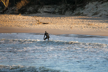 Fototapeta na wymiar winter surfer in baltic sea 