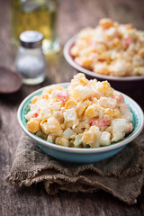 Salad with crab sticks, rice and corn