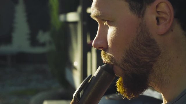 Close up portrait of musician playing ethnic flute