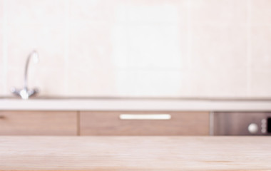 Empty table with kitchen in background