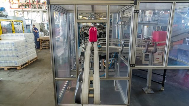 A factory for plastic canister production timelapse hyperlapse. The conveyor in the factory.