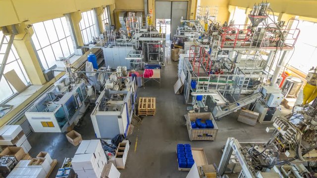A factory for plastic canister production timelapse hyperlapse. The conveyor in the factory.