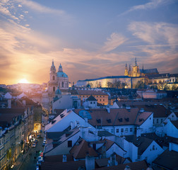 Roofs of Prague and St. Vitus Cathedral on a sunset