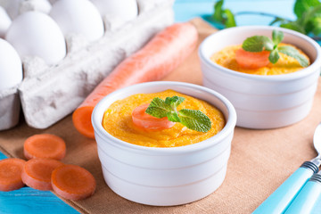 Сarrot souffle with with chicken on wooden table