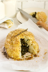 Stuffed cauliflower with chard and bread crumbs. Rustic style.