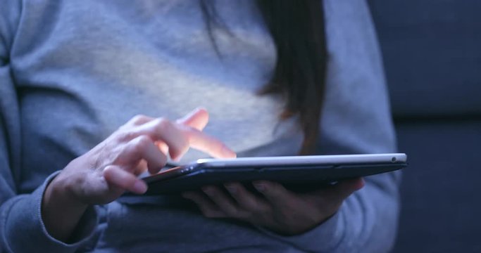 Woman use of digital tablet at home