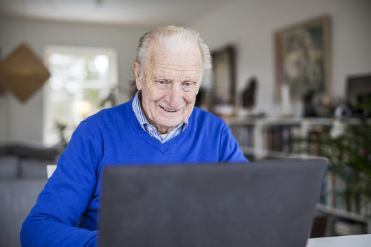 Senior man using laptop
