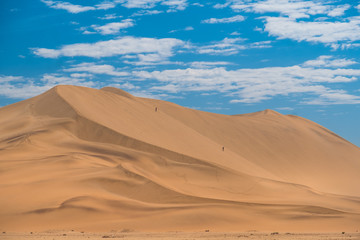 Fototapeta na wymiar Dune 7, a very large sand dune area at the edge of the Namib desert near the harbor city of Walvis Bay, Namib-Naukluft National Park, Namibia.