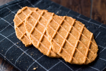 Fresh Crisp Waffles on Black Tablecloth.