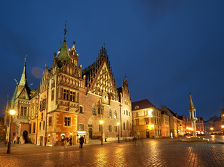 Market square and Town Hall in Wroclaw, Poland, on a rainy night